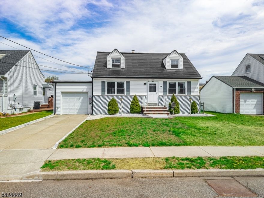 Move right in! This beautifully maintained home in ideally located in Bergen County, near schools, shopping, NJ Transit, and just one block from Carlock Field, featuring a playground, turf field, activities, events, camps, and more. On the first floor, you'll find gleaming hardwood floors, a bright and spacious living room, convenient primary bedroom, second bedroom, a full bath, and a functional galley kitchen with adjoining dining area. Upstairs, you'll find two additional nice-size bedrooms and plenty of natural light. The full, walk-out basement offers excellent potential to finish and customize to your needs. Step outside to a level, charming backyard, perfect for relaxing or entertaining. A standout feature is the newly installed Tesla roof, offering sleek, modern efficiency along with the added benefit of energy generation. Don't miss the opportunity to own a home in a convenient and desirable location.