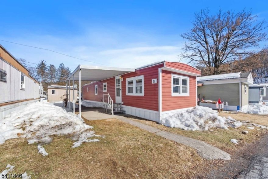 Settle into this completely renovated manufactured home along the Delaware River. The 2 bedrooms and 1 bathroom compliment the open floor plan living, dining, and kitchen areas. The charm is in the 'barn chic' style that create a warm, yet sophisticated atmosphere. Featuring a luxury raised panel ceiling throughout, solid wood doors and baseboards, and 2-inch mini-blinds throughout, each room feels like a deluxe country home. The master bedroom is filled with natural light. The second bedroom is big enough to use as a guest room or walk-in closet. The kitchen has all new cabinets, countertop, stainless Whirlpool kitchen appliances, including an above-range microwave, double-basin sink with a pull-out faucet, floor-to-ceiling pantry, and a versatile movable island with a butcher block top. All the plumbing lines have been upgraded. Newer roof. Covered patio. Shed included.