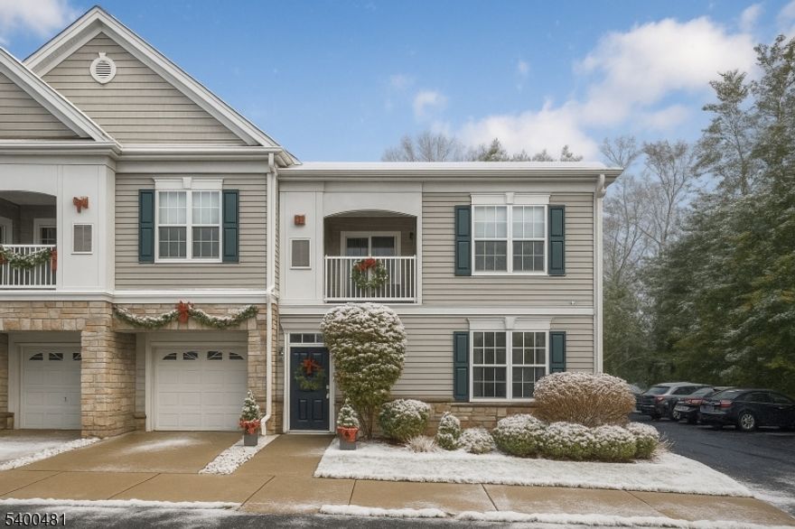 Beautifully maintained end unit in The Grande, featuring the sought-after Florham model with two bedrooms, two full bathrooms, and a one-car garage. This updated home offers an open-concept layout with hardwood flooring, in-unit laundry, and a first-floor bedroom with an adjacent full bath. The kitchen is appointed with stainless steel appliances and granite countertops. The private primary suite occupies the second floor, complete with walk-in closets and an en-suite bath. Community amenities include a pool, gym, and clubhouse.