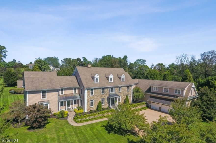 A resplendent Bernards estate is offered by its original owners. This stone front Bucks County manor is set on 2.8 landscaped acres along a cul de sac in a neighborhood of other fine homes. Highlights include an updated chef's kitchen featuring upscale appliances, a maple paneled two-story library with office loft, a piano room opening to the front yard, an elegant primary suite connecting to a new spa-like bath, a huge game room which could be a bedroom suite, unique designer baths, hardwood floors throughout, intricate millwork and 4 fireplaces. Three levels of beautifully-finished living space offer 7 bedrooms, 5 full and 2 half baths. Partially finished basement with tile and wood burning fireplace.  Great space for a home theater.  Resort-caliber grounds invite outdoor living with level lawns edged by mature trees, colorful gardens, a playhouse and a heated saltwater pool with a spa and waterfalls. Attached 3-car garage for ample storage needs.Ideal for large-scale or intimate entertaining, this sophisticated manor Is minutes from local and interstate highways, excellent schools, Basking Ridge shops, dining and recreation. Mechanicals include multi-zoned HVAC, a whole house security system, generator and exterior video cameras. This incredible home needs to be seen to appreciate!