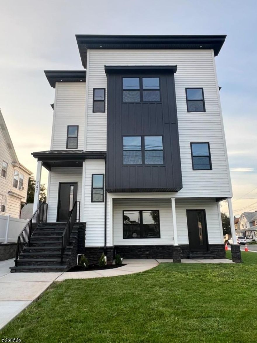 Stunning brand new two family home built with utmost attention to detail with so much to offer. First floor has an oversized two car garage, a large rec room with a full bathroom and laundry room connecting to first apartment with 3 bedrooms, living room, dining room, kitchen, two full bathrooms and a second laundry room. Second apartment also has 3 bedrooms, living room, dining room, kitchen, laundry room and two full bathrooms. Wood & ceramic floors throughout. Vinyl floor on ground level. Central AC/ heat, separate utilities. 10 year H.O.W. Owner occupied house may qualify for 5 year tax abatement.