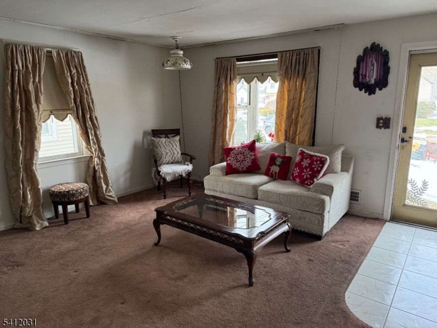 A lovely four bedroom, two bath cape style home in a quiet, highly sought after neighborhood in Lyndhurst. One family owned for many years. The first floor has high ceilings and features a cozy living room, eat-in kitchen, two bedrooms, a den / office, a full bath and a bright enclosed porch / sunroom. The second floor offers two large bedrooms, and a second full bath. The unfinished basement has many possibilities and can be finished to your desire. Out back there's a spacious fenced in yard, and detached one-car garage. Close to parks, schools and a short walk to the NYC commuter bus or train. A minute drive to Route 3. Bring your design ideas and special touches to make this fabulous home your own!