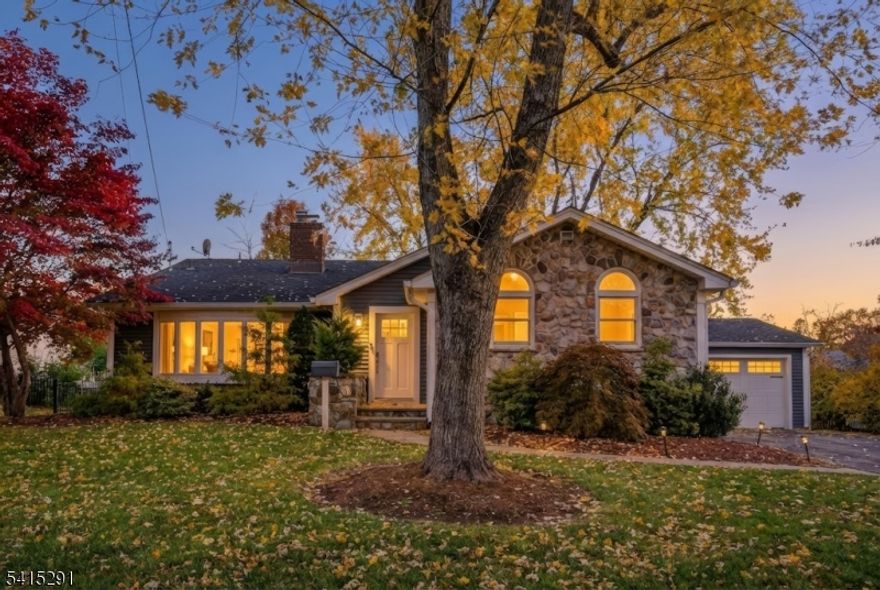 This warm and welcoming 4-bedroom, 2.1-bath home on E. Broad Street offers four levels of comfortable, flexible living designed for today's lifestyle. The main level feels bright and airy, with dramatic double-height ceilings and an seamless flow, between the chef's kitchen with a Wolf range and build in grill, the open dining room and sunken living room, creating an ideal setting for everyday living and effortless entertaining.  A convenient ground-level 4th bedroom, inviting family room, custom mudroom  and nearby powder room are ideal for guests or  perfect home office.  Upstairs, you'll find a relaxing primary suite with a spa-like steam shower,TOTO  washlet, heated toilet seat with bidet. Two additional bedrooms, and a well-appointed full hallway bathroom, providing plenty of room for everyone. The finished basement offers a cozy recreation room perfect for movies, play, workouts, or hobbies. Outside, the backyard is ready for fun with its own half-court basketball court! The garage also has an EV outlet. Move-in ready and ideally located in one of Westfield's most sought after neighborhoods, this home offers space, comfort and lifestyle that today's buyers are looking for! Top rated Westfield schooly system!