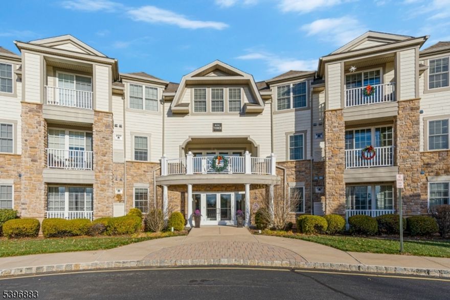 Welcome to this stunning open-concept home in the sought-after Four Seasons at Bridgewater, an active adult (55+) community offering resort-style living. This spacious residence features a bright and airy floor plan with high ceilings, crown molding, and recessed lighting throughout the main living and dining areas perfect for entertaining or relaxing. The modern kitchen is a chef's delight, complete with Maple wood cabinetry, granite countertops, stainless steel appliances, and a convenient breakfast bar. The primary suite offers a generous walk-in closet and a private en suite bath with a dual-sink vanity and stall shower. A second bedroom and full bath provide plenty of space for guests or a home office. Additional highlights include a private enclosed garage, elevator access and a dedicated storage unit. Enjoy the community's exceptional amenities clubhouse, fitness center, outdoor pool and hot tub, landscaped gardens, and a calendar full of social events. Conveniently located near shopping, restaurants, major highways, and transportation hubs. Experience the perfect blend of comfort, convenience, and community living at Four Seasons at Bridgewater!