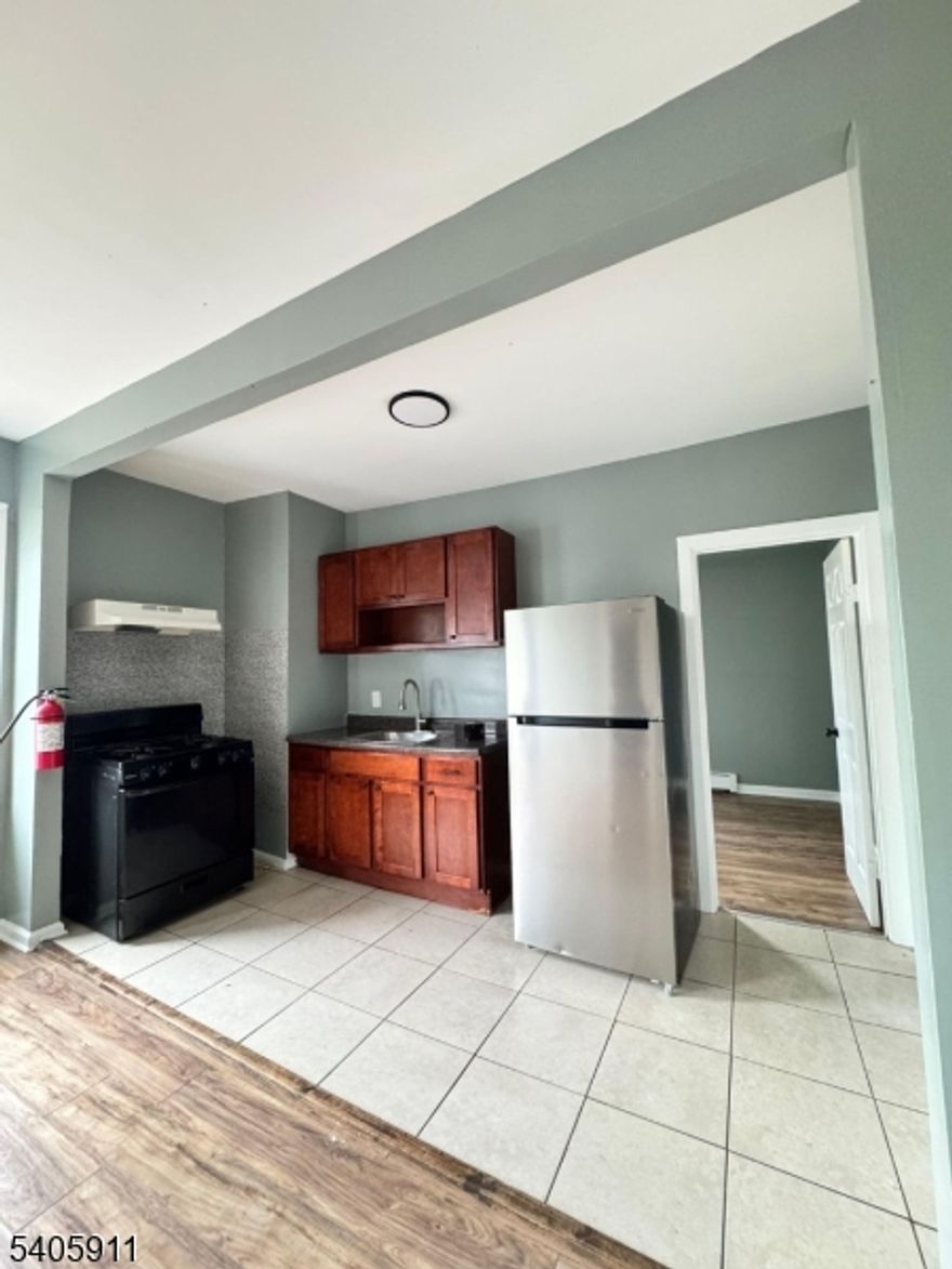 Welcome to this inviting two-bedroom apartment located at 377 S 10th Street in Newark, NJ. This well-proportioned home offers a comfortable layout featuring a spacious living area, two generously sized bedrooms, and a functional kitchen ideal for everyday living. Natural light enhances the space, creating a warm and welcoming atmosphere throughout. Conveniently situated near local shops, restaurants, public transportation, and major highways, this apartment provides easy access to everything Newark has to offer. An excellent option for those seeking comfort, convenience, and city living.