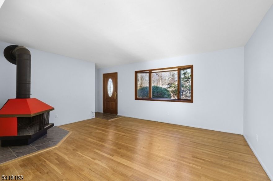 Discover the perfect blend of charm, convenience, and natural serenity at this move-in ready single-family home in the highly desirable Cupsaw Lake (membership Optional) area of Ringwood, NJ. Nestled in the heart of the scenic Ramapo Mountains and Skylands region just about 40 miles northwest of New York City, this cozy residence, sits on a generous 0.34-acre lot, offers peaceful, rural living with easy access to urban amenities. Gleaming white oak hardwood floors flow throughout, infusing the well-maintained interior with timeless warmth and an inviting atmosphere that requires no immediate updates. Enjoy the finished basement and step outside to your private backyard oasis, featuring a picturesque small pond exclusive to the property, where you can relax with morning coffee, enjoy tranquil water views, or simply unwind amid nature's beauty in your fenced retreat. Ideal for first-time buyers, downsizers, or anyone craving a quiet, nature-oriented lifestyle, this home sits in a tight-knit, friendly community surrounded by state parks, hiking trails, the New Jersey Botanical Garden at Skylands, and year-round lake activities. Embrace the best of Ringwood's low-crime, welcoming vibe and outdoor paradise don't miss this rare opportunity to own a slice of tranquil lakeside living.