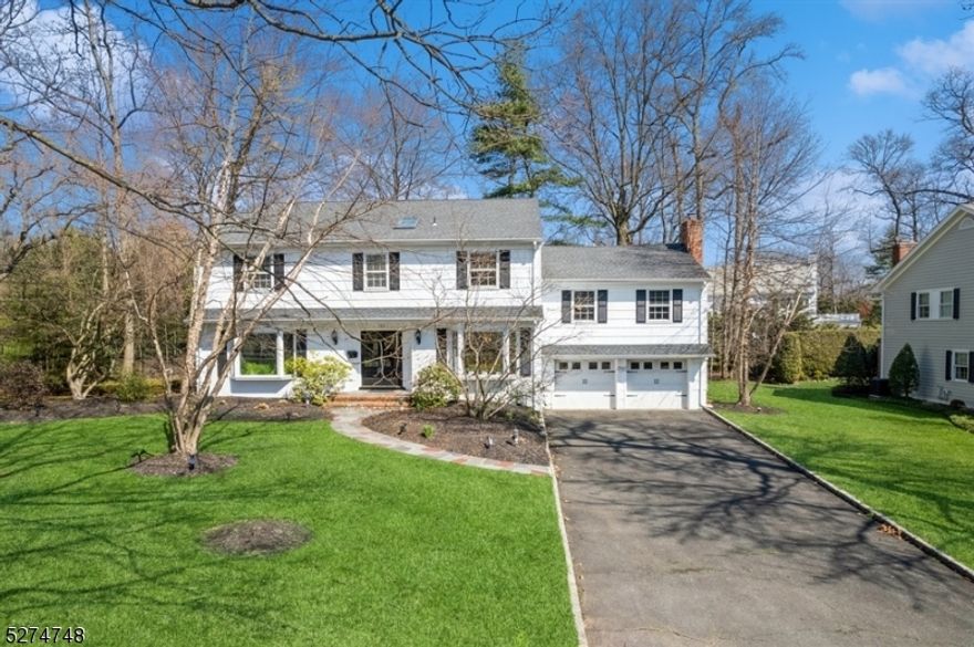 Nestled in the heart of the premiere Indian Forest section of Westfield, this light and bright 4 bedroom, 4.1 bath colonial sits on .37 of an acre of flat land. Gorgeous, large, sun-filled living spaces with hand hewn beams, a flowing layout that is perfect for entertaining, and many updates such as 1 year old heating and air conditioning systems are just a few of the highlights of this special home.  Double glass doors open to the large foyer, living room, and spacious dining room with showcase light fixture and plenty of room for all of your guests. Continue on to the family room with wood-burning fireplace, white country kitchen with walk-in pantry, high end appliances, center island, and separate eating space, all with sweeping views of the beautiful and serene backyard. A powder bath and garage access complete the floor. A second family room with fireplace is both cozy and expansive, a perfect space for game nights or winter puzzles by the fire, is a half floor up, along with a wet bar, a full bathroom, and convenient first floor laundry. Upstairs includes an oversized primary bedroom with walk-in closet and en suite bath with stall shower, 3 additional bedrooms, and hall bath. Head to the finished basement to workout in the rec room, or to select a bottle of wine from the temperature controlled wine room.This top notch location offers easy access to top-rated schools, vibrant downtown shops and restaurants, and NYC commuter routes.