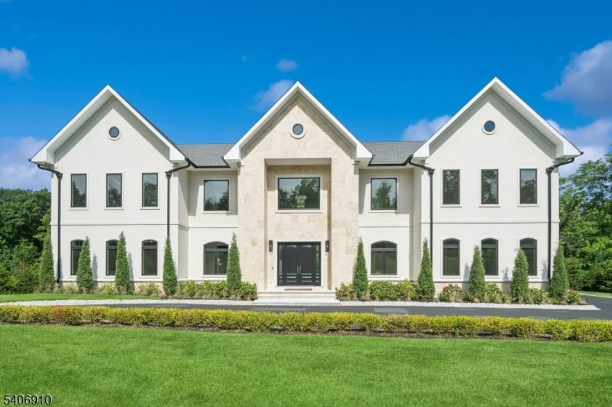 Welcome to this stunning, brand-new built 39 Westmount Drive, a rare offering that combines architectural elegance with modern luxury in one of Livingston's Bel Air, most coveted neighborhoods. This is not simply a home; it is a statement of lifestyle, success, and timeless taste. Sun-filled living level with oversized windows, high ceilings, two-way 22'FT fireplace. A chef-driven kitchen with Sub Zero, Dacor, Wolf appliances, dual dishwashers & statement lighting throughout. Every detail has been meticulously curated to the highest standard, from bespoke finishes to thoughtfully designed living spaces that strike a balance between sophistication and warmth. Expansive formal rooms flow effortlessly into inviting gathering areas. 7 en suite bedrooms provide comfort and privacy, and a luxurious primary suite is a true retreat with heated bathroom floors & spa-inspired finishes. Maple wood custom closets, smart home technology, cameras & endless refined finishes at every turn. A versatile lower level complete with media room, wet bar, bedroom & gym. Outdoors, sweeping views, a rooftop deck with a fireplace, the property becomes a private sanctuary, ideal for entertaining, peaceful mornings, and unforgettable moments. Proximity to fine dining, shopping, houses of worship, major highways & easy access to NYC. This home delivers the rare combination of prestige, privacy, and convenience. 39 Westmount Dr is more than an address - it is an opportunity to elevate your life.