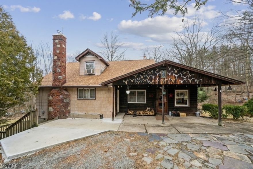 Come home to nature!Welcome to your own private hideaway in the woods! This cozy country cabin is nestled on close to one full acre of land that backs up to the Norvin Green State Forest with trails for hiking, fishing, hunting, biking, and so much more.  This versatile home with a rustic vibe features hardwood floors, stunning views of the countryside from every room, a convenient separate second kitchen, a NEW roof and gutters, boiler, water heater, water line and septic field. The first floor includes a large living room with a wood-beamed ceiling, a wood-burning stove set in the fireplace, and a huge picture window. The dining room opens to the eat-in kitchen with stainless steel appliances and generous cabinet and counter space. Three good-sized bedrooms and a full bathroom complete this level. The second floor offers a bonus living space that is perfect for extended visits complete with a bedroom, a full bathroom, a family room, a kitchen, and numerous closets. The walk-out basement will suit all your storage needs, outdoor recreational gear, and vehicles, along with a handy storage shed in the back yard. This property is located across from the New Weis Center for Education, Arts, and Recreation, providing access to the Highland natural pool, outdoor events, and nearly twenty-four miles of hiking trails. This home is also convenient to I-287 and Route 23.