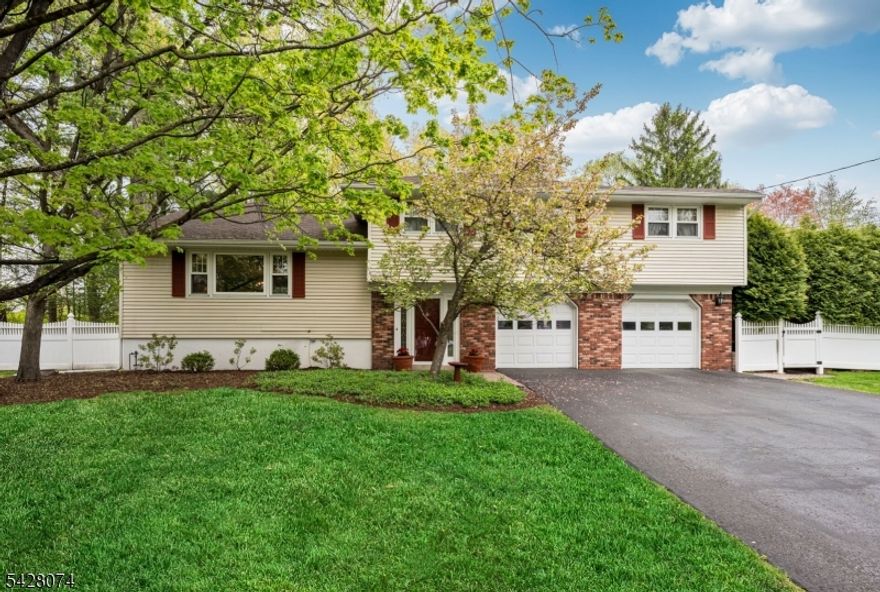 Tucked away on a quiet cul-de-sac in desirable Wyckoff, this beautifully maintained split-level home offers 3,096 square feet of thoughtfully designed living space. Hardwood floors run throughout, complemented by elegant crown mouldings that add timeless character. A formal dining room with French doors opens seamlessly to the sun-filled great room addition, creating an ideal flow for entertaining and everyday living. The great room is warm and inviting, enhanced by one of two gas fireplaces for added comfort and ambiance. The finished basement offers additional living and storage space, including cedar closets that provide ample room for organization. An oversized attached two-car garage adds everyday convenience. Step outside to your own private backyard retreat featuring a pool?ideal for relaxing or hosting summer gatherings. Located just a block from the NYC bus and close to award-winning Blue Ribbon schools, this home combines a peaceful neighborhood setting with exceptional lifestyle amenities.