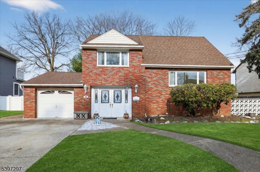 Welcome to 66 Jamros Terrace! Character, warmth & storybook charm in Saddle Brook?s most desirable neighborhood. From the moment you pull up, the handcrafted brickwork & inviting curb appeal set the tone for something truly special. This expanded 3-bedroom split level has been cared for, loved & owned by for nearly 70 years! Ground level offers a spacious family room w/ sleek white tile floors & an updated full bath. Upstairs a bright eat-in kitchen w/ exposed handcrafted brick, flows effortlessly into the living room. Exposed wood beams on the ceiling, more brick detail & gas fireplace, this space feels both cozy & timeless; perfect for holiday mornings & Sunday afternoons. Open the door to the patio & the level park-like backyard. Best of all, it backs up to town-owned sports fields, gives the feel of extra land w/out the upkeep. Oversized dining room w/ big sun-filled windows, perfect for gatherings. Upper level contains 3 large bedrooms, all w/ hardwood flooring & a full bath. Storage is no issue w/ 2 attics (1 in the garage, the other in the 3rd bedroom), plus an unfinished basement w/ a washer/dryer & endless potential for additional recreation space in the future. The converted, heated garage gives you the flexibility to park your car, additional living space or a potential 4th bedroom. The private 2-car driveway is a huge bonus. Homes with this much charm, character, and usable yard space don?t last, especially in this location. Schedule your showing today!