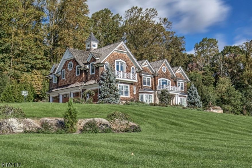 Exceptional Custom Shingle-Style residence with long views evokes images of homes in Newport and The Hamptons. This is the lifestyle you deserve! Four finished levels of highly skilled craftsmanship and beautiful appointments. Details include distinctive moldings, coffered ceilings, solid core doors, Brazilian cherry, limestone, tile and marble floors. At one end of the main level is a mahogany paneled Library/Office-ideal for working at home. A Chef's Kitchen with high end appliances opens to the two story Family Room.Five en-suite generously sized Bedrooms include one on the main level. The second level Primary Suite offers a spacious bathroom with jetted tub and steam shower 'room', two expansive fitted closets, a light filled cupola, a sitting area and a balcony with distant views.The lower level has an entertaining area with full bar, powder room, a game/storage room, exercise area and storage while the third floor has an office, half bath, recreation and storage areas.The home has two laundry rooms, an elevator accessing all four levels and a four car garage.Generator- whole house except AC units.Creston audio system,Smart Home technology-and more! Room for a pool. Just minutes to Oldwick village and I-78 for commuting,approx 45 mins by car to Newark Liberty International Airport and  60 mins to NYC. Fine dining, golf clubs,farm stands, equestrian facilities and shopping all nearby. Tewksbury Twp is well known for its natural beauty. Additional land may be available.