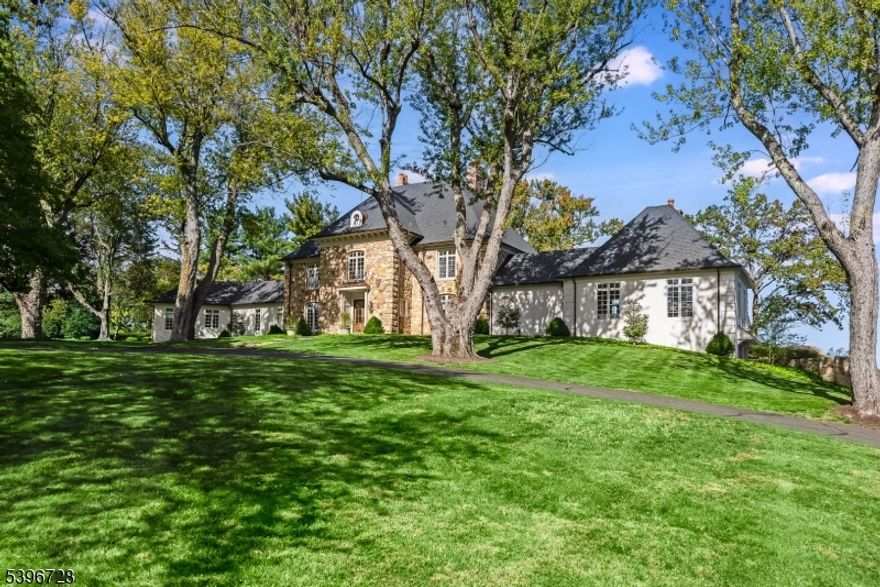 Perched atop nearly eight picturesque acres, this 8,000+ square-foot Mendham Borough estate has been reimagined in 2025 with a level of craftsmanship and artistry rarely seen in today's market. Designed for both grand entertaining and intimate living, the residence seamlessly blends architectural elegance, exquisite d cor, and modern amenities. From sunrise to star-filled twilight, the horizon stretches endlessly, creating a living backdrop that shifts with the seasons and elevates every moment. Outdoor living is equally impressive with a saline pool and spa with remote Aqua Link control, limestone barbeque bar, and a custom-designed outdoor fireplace, all framed by professional landscaping from Root Landscape Architects. Copper roof accents, new stone entry pillars, and a detached four-car garage underscore the estate's enduring quality.  This is more than a home; it's a lifestyle. Morning coffee comes with a horizon line and evenings glow in sunset color. Whether hosting elegant parties under sparkling chandeliers, enjoying quiet moments by one of the many fireplaces, or soaking in vibrant sunsets from the terrace, this refined residence offers a rare opportunity to live expansively while embracing every refined detail.