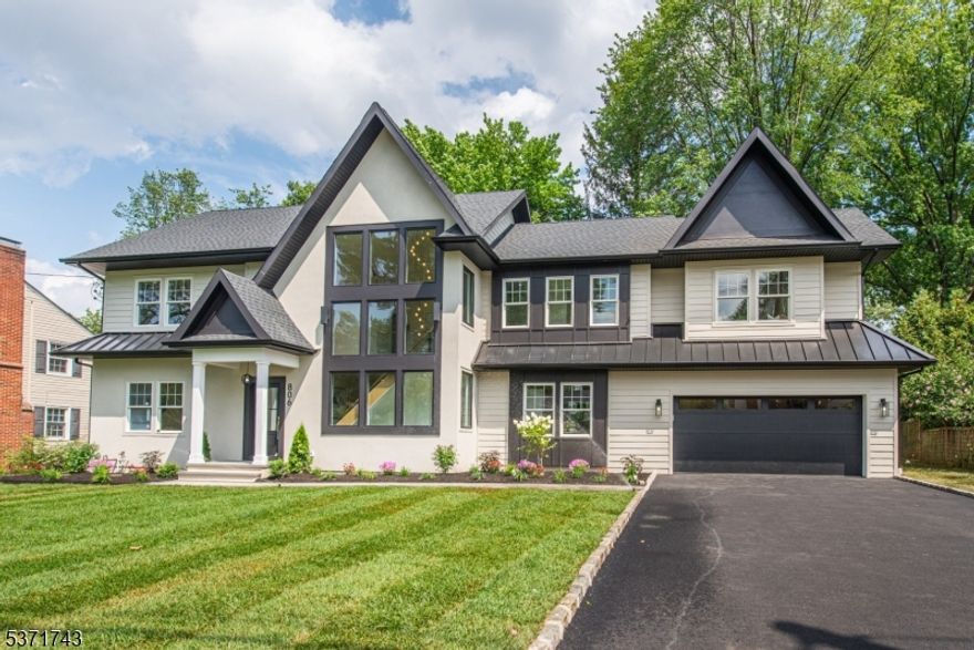 Your Dream Just Came True. Finally, a home that WOW's your guests?right in the heart of Westfield. Thoughtfully curated by award-winning Samaan Design Group & meticulously built by Champion Estates, this is no cookie-cutter new  built. It?s a masterpiece for the discerning buyer who values taste, design, and quality. Step into a stunning 2-story glass atrium foyer that fills the home with natural light. The expansive family room with 9-foot ceilings is perfect for entertaining, featuring a center fireplace and 4-panel glass doors that open to the spacious backyard for seamless indoor-outdoor living. The kitchen is a culinary showpiece, with dual islands, Taj Mahal Quartz Counters, and matte black commercial-grade appliances. A custom dining room with built-ins and a beverage center sets the stage for unforgettable meals. Upstairs, the luxurious primary suite is a private retreat with vaulted ceilings, custom built-ins, and a large walk-in closet. The spa-like bath includes a wetroom and 8-foot double vanity. There are 5 spacious guest bedrooms, including a first-floor ensuite, a 2nd floor princess suite. and basement au-pair suite. The finished basement is perfect for entertaining with additional rec room. A 2-car garage connects to a mudroom for added convenience. All located in one of Westfield?s most desirable neighborhoods, next to Washington Elementary and less than a mile to downtown and the NYC train. This home is the perfect blend of style, space, and location.