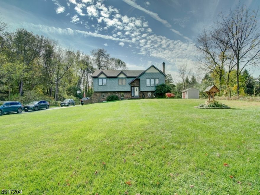 Charming and immaculate 3 Bedroom, 2 Full Bath bi-level situated on nearly one acre of beautiful property.  Quiet and peaceful neighborhood. The large, eat-in Kitchen features separate dining area, breakfast bar and stainless steel appliances.  The ground floor features barn door sliders and a Family room with newer pellet stove for those chilly nights in the country. Also included on the ground floor is a den/office/guest room. New water heater (2022). Generator hook-up. And you'll love relaxing or barbecuing on the entertaining-sized deck! Convenient location--just minutes to top-rated schools and minutes from Routes 23,15 and 94, High Point State Park, Mountain Creek ski area, hiking trails, proximity to shopping and dining.