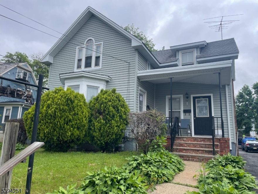 Great Investment Property.  OR GREAT FOR CONTRACTOR.  HUGH 2 BAY GARAGE. BIG BACK YARD.FORMER USES INCLUDE  LIMO COMPANY, PAVING CO. GENERAL CONTRACTOR.  Consistent income provider. 3 Rental Units. ( Two residential units plus one garage tenant. ) Home was just resided 2025 and roof within 3 years. 2nd floor unit will be vacant & available November 1, 2025. New owner can live in or rent out.Oil Tank in Basement. GROSS INCOME $72,600.00 annual