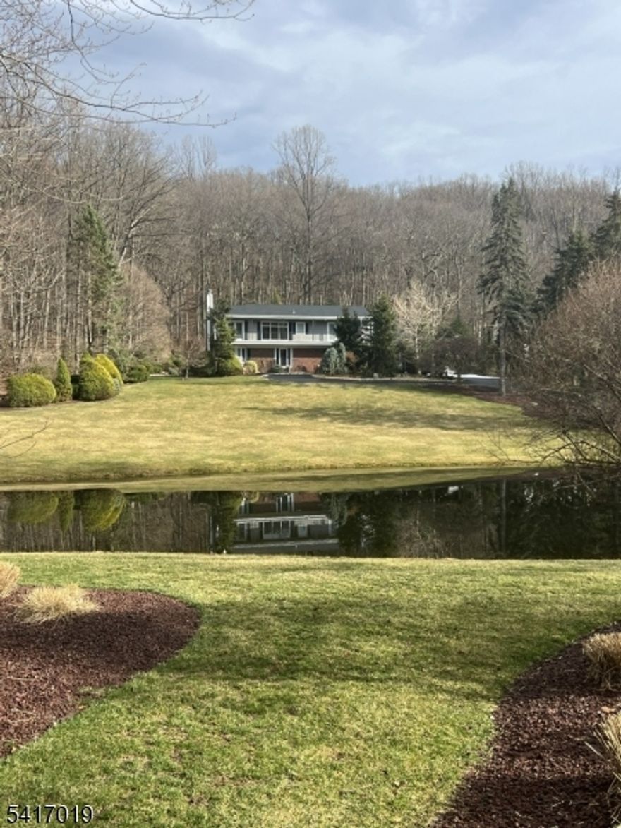 Pool or Pond...no choice needed you get both!!! It begins with an impressively long private drive as you slip away to this remote paradise on over 2.5 acres. This custom Colonial offers updates and remodels to kitchen, baths, finished bsmt, and more. This is the home Denville buyers dream about - 4 Bedrooms, 4 Baths, a 1st floor swing room Br/or office for in-law suite or work at home with heavenly view - you decide?  Details and quality will impress the fussiest buyers while the location and privacy will secure a spot like no other. In addition...you get great room, 4 season room, large formal living and dining room, fabulous eat in kitchen, huge primary bedroom, rec room, gym area, storage room, basement bar, sauna, and a beautiful fenced rear yard with in-ground pool.  Homes like this don't come arounf often..A truly must see!!!