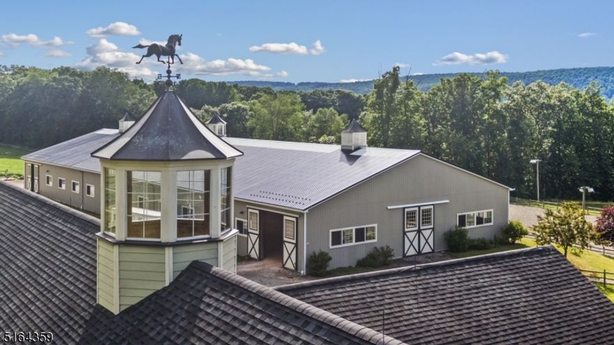Often admired, now available for the first time...16 Hands Farm! Sweeping vistas and breathtaking pastoral views frame this stunning 17 stall equine riding facility brilliantly set on 54+ acres in Long Valley. At its heart is the handsomely appointed 13 stall center aisle barn meticulously designed by owner and King Construction to accommodate many equestrian disciplines. Featuring 12'x12' matted box stalls w/ automatic waterers, wash stall w/ heat lamps and hot/cold water, grooming stall/farrier station, 9 cooling fans and large laundry room. The heated tack room has custom storage cubbies, kitchenette and full bath - you'll see that no detail has been overlooked. Upstairs, adjacent to the large hay loft, is a spacious groom's apartment w/ eat-in kitchen, large living room and sleeping quarters. Ride in comfort year-round with the 80'x200' indoor riding arena with GGT footing and mirrors with an attached multi-functional 20'x80' workshop. An adjacent 4-stall shed row barn completes the 17 stall complex. The 100'x200' outdoor arena has lights and sprinkler hook-ups. 20 paddocks include large rolling fields, as well as small screening paddocks to accommodate every horse's needs; most are equipped with automatic waterers, and 4 run-in sheds providing a full complement of options for daily or night turnout. A beautiful 3 BR, 2.1 BA home with finished lower level and beautiful backyard paver patio overlooking tranquil perennial gardens completes this one-of-a-kind property!