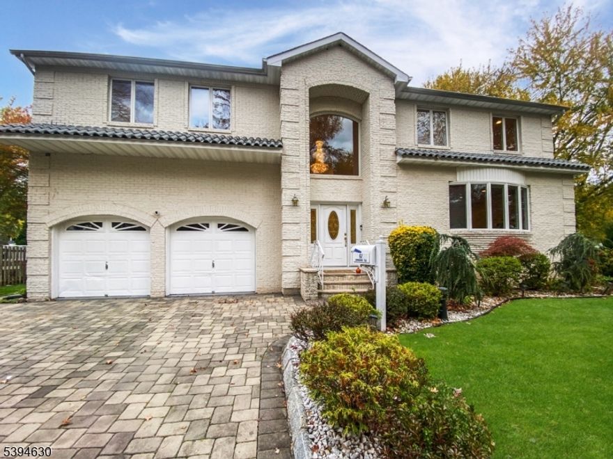 THIS IMPRESSIVE RESIDENCE COMPLETELY REBUILT IN 2002 BY THE CURRENT OWNER WHO HAS OCCUPIED THE PROPERTY SINCE 2000, OFFERS ALL OF COMFORTS YOU'D EXPECT IN A NEWER HOME! SOARING CEILINGS, RECESSED LIGHTS, HARDWOOD FLOORS, WALK-IN CLOSETS, 3 FULL BATHS WITH WALK IN SHOWER STALLS, 2ND FL BONUS ROOM, CENTRAL VAC, 2ND FL LAUNDRY & MORE! IF YOU'VE BEEN DREAMING OF A FOREVER HOME TO MAKE YOUR OWN, THIS PROPERTY OFFERS THE ULTIMATE HEAD START! IT'S SPACIOUSNESS AND LOCATION MAKE IT THE IDEAL STARTER PACKAGE! ALREADY BRIGHT AND EXPANSIVE, THIS HOME OFFERS LIMITLESS POTENTIAL! A DRAMATIC TWO STORY ENTRY FOYER WITH  PICTURE WINDOW SHOWCASES A CRYSTAL CHANDELIER ON A MOTORIZED LIFT! SKYLIGHTS AND CUSTOM WINDOWS MAKE EVERY DAY A BRIGHT ONE! THE SEAMLESS KITCHEN COUNTERTOP-TO- BACKSPLASH DESIGN MAKE CLEANING EASY AND INCL UNDER CAB LIGHTS AND A BREAKFAST BAR BOASTING DEEP UPPER AND LOWER CABINETS! ANDERSEN SLIDERS TO THE DECK FROM BOTH THE KITCHEN AND DINING ROOM PROVIDE FUNCTION AND FLOW TO THIS FLOOR PLAN! NO ADDITIONS NEEDED HERE! 1ST FL BEDROOM SUITE,MUD ROOM, GUEST POWDER, FAMILY RM OUTFITTED FOR A FIREPLACE AND SPACE FOR A BUTLER'S PANTRY. THE PERFECT OPPORTUNITY FOR ANY SAVVY BUYER! THE EXTERIOR  OPTIONS ARE DESIGNED FOR THE ULTIMATE STAYCATION, FEATURING A 4 CAR PAVED DRIVEWAY, A HUGE PAVER PATIO, RAISED DECK, AND GAZEBO, WITH SPACE LEFT OVER FOR A POOL! LOW TAXES FOR THIS AMOUNT OF SPACE  AND IN THIS DESIRABLE LOCATION MAKE THIS  OPPORTUNITY HARD TO BEAT!