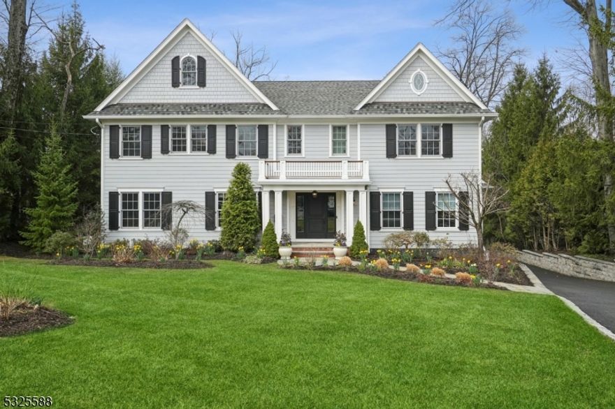 Nestled in Ridgewood's prestigious Country Club section, this expansive 5-bedroom, 5.1-bathroom home offers elegance, modern convenience, and stunning outdoor living. Inside, soaring ceilings and an open layout enhance the home's grandeur. The designer eat-in kitchen boasts high-end appliances, while the first floor features a great room, family room, dining room, sitting room, and a bedroom with a full bath. Upstairs, the luxurious primary suite includes a sitting area, dressing room, spa-like bath with a steam shower and soaking tub, and large windows overlooking the picturesque backyard. 3 additional bedrooms and 2 bathrooms complete the second floor. The lower level offers a gym, rec room, office, bonus room, storage, and full bath. A 3-car garage, whole-house generator, and sprinkler system complete this exceptional property. Enjoy the beautifully landscaped yard, fully fenced for privacy, with a heated saltwater pool, lush gardens, and direct access to the neighboring park. Multiple porches and a spacious deck with a gas grill hookup provide the perfect setting for outdoor dining and relaxation.