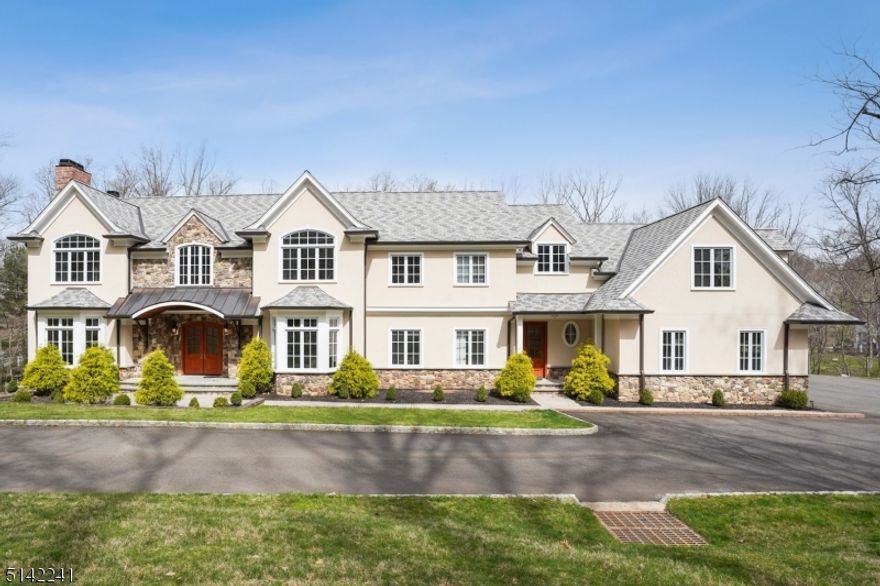 Beautiful custom home with over 7000 square feet of living space on 5 acres with wonderful views. A circular driveway leads to a large entry hall with circular staircase. Six en suite bedrooms including one on the first level and two additional powder rooms. Amazing kitchen with huge center island and dining area. Top-of-the-line appliances including DCS professional cooktop and oven. Master suite with sitting room and fireplace. Beautiful windows throughout and fine millwork. No shortcuts here. Four fireplaces, a four-car garage, plenty of space to spread out and wonderful flow for entertaining.