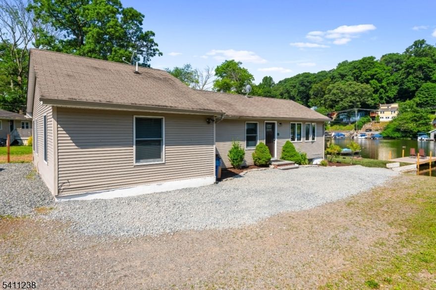 Welcome home to your lake front retreat! Updated 3 BR LAKE FRONT apartment! Absolutely immaculate 3 Bedroom, 1 Bathroom apartment that's been very well-maintained - Needs nothing! Newer hardwood floors, and paint, newer appliances, and fixtures! Laundry is a breeze with the washer and dryer in unit. Private off-street entrance with parking for 2 vehicles. Enjoy access to Lake Hopatcong from the property - Enjoy the Beach Club in walking distance for an added fee. Just minutes from Routes 80, 46, 10, and 15. Available immediately - lake season is coming up! Tenant pays for all utilities (heat, oil, electric, and cable/internet). Don't miss this one! Landlord requires credit report, background check, income verification, and all deposits up front. 1 year lease with option to renew. NO PETS, NO EXCEPTIONS.