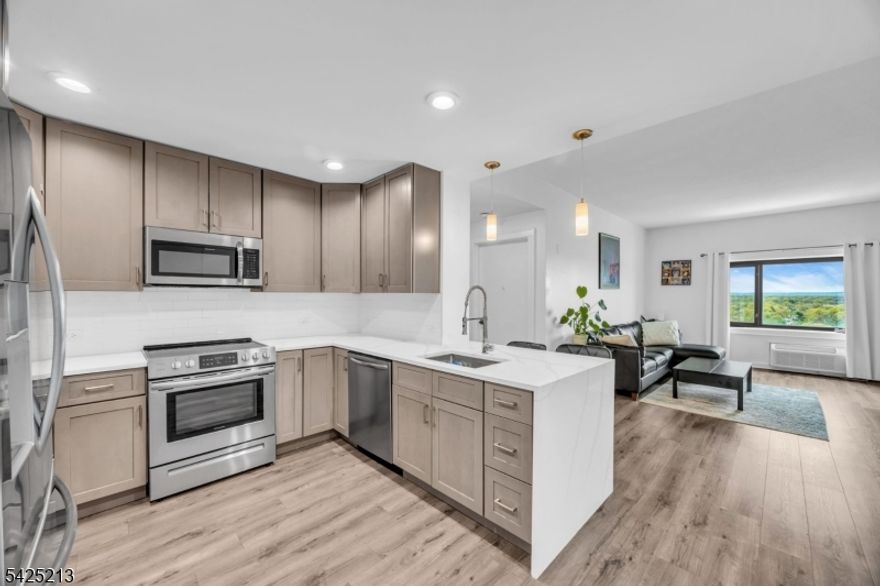 Welcome to a fully renovated 2-bedroom, 2-bath condo on the 16th floor of Skyview (Unit #1620).  Bright and spacious with stunning city views, this home was completely updated in 2022 and offers modern open-concept living. The kitchen features stainless steel appliances and flows seamlessly into the living area- perfect for entertaining. Both bathrooms are generously sized and thoughtfully updated, including a primary suite with a walk-in shower, and double sink vanity.  Additional upgrades include a new washer and dryer (2022), and New AC units (2023), gray shaker cabinets, quartz countertops ,  Aged Oak scratch resistant laminate wood flooring.  Located in the heart of Rahway, steps from NJ Transit, enjoy direct access to Manhattan, gym, garage parking ($120/month per car),lounge, and a rooftop terrace with grills. This move-in-ready home combines style, comfort, and breathtaking views in one exceptional package. Sewer, water, trash collection and snow removal are covered by HOA fees. ($503.22)