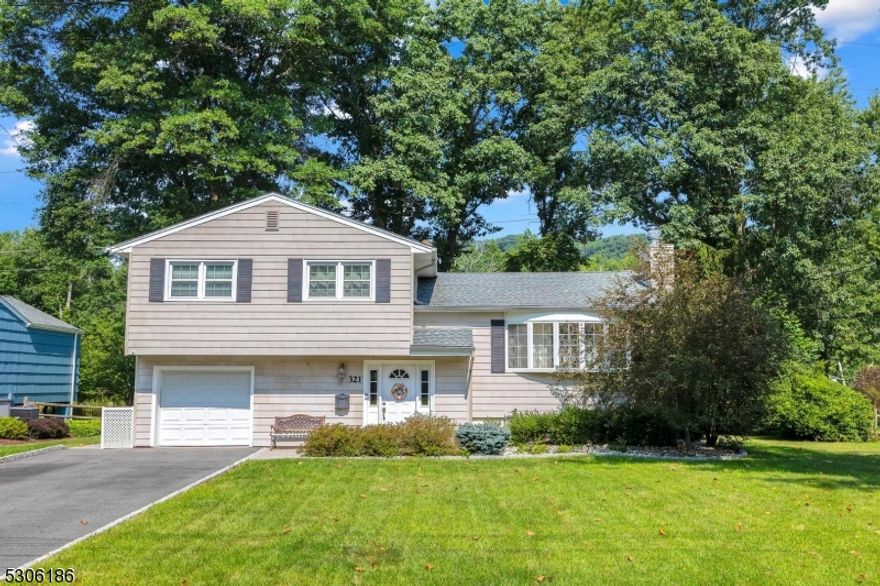 Beautifully updated and well-maintained split level home located on quiet friendly street in this highly desirable New Providence neighborhood.  Gorgeous kitchen with all new stainless steel appliances, granite countertops, drawer microwave,  nicely accented cabinets and recessed lighting.  Luxury vinyl plank flooring throughout, stone fireplace, updated bathrooms &  finished basement.  Private backyard with paver patio, underground sprinkler system and generator hookup complete this fully renovated move in ready home.  Top rated school system plus short walk to downtown and bus station to NYC make this house a can't miss.