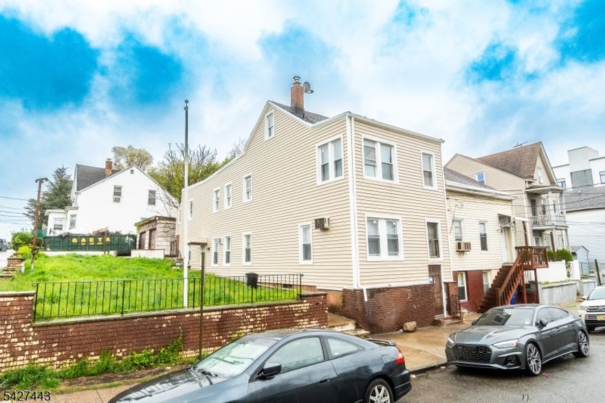 Rare opportunity in the heart of South Paterson. Endless Opportunities at this renovated two-family that sits on an oversized 50x100 corner lot with a private driveway and detached garage, a combination that is extremely hard to find in this area. What truly sets this property apart is the ability for future expansion or potential to build an additional structure, adding a unique layer of value rarely seen in this market (subject to buyer due diligence and municipal approvals).Recent upgrades include brand new siding, a brand new roof, brand new first-floor windows, and a newer furnace. The property features two units with separate living spaces, making it ideal for both investors and first-time owner-occupants. The finished basement adds additional usable space, while the lot size and corner positioning provide flexibility and long-term value. Conveniently located just steps from Main Avenue, shopping, restaurants, public transportation, and major highways, making this an extremely accessible and desirable location for both living and renting.