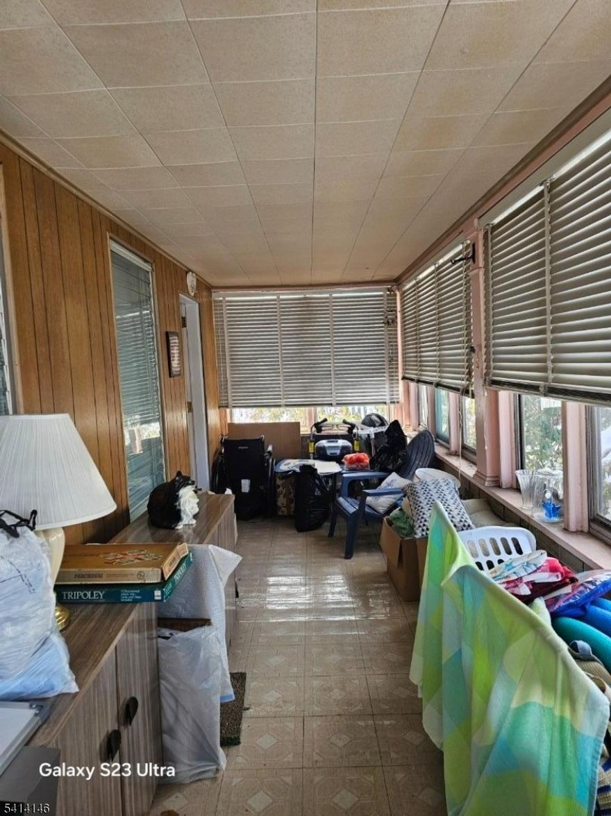 Welcome to this cozy one-family home offering 7 Rooms, 3 bedrooms, 1 small bedroom or office, and 1.5 bathrooms. The main level features a 3-season enclosed porch, living room and a formal dining room, perfect for everyday living. A full Unfinished basement with laundry area. A must-see home offering comfort, space, and convenience. Conveniently located near shopping are and Close to public transportation to New York City, making this home ideal for commuters.