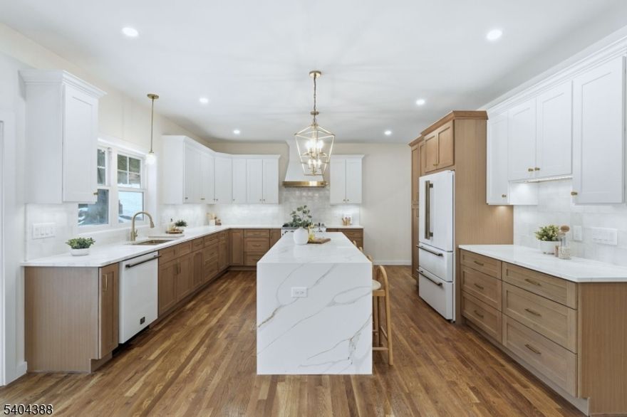 Welcome to this beautifully renovated side-hall Colonial,where timeless architectural charm meets modern luxury living.This elegant home offers four generously sized bedrooms, three full bathrooms & one powder room,all thoughtfully reimagined w/exceptional attention to detail.Refined finishes throughout include sophisticated custom molding,designer lighting & premium quartz countertops.The gourmet chef's kitchen is a true showpiece,featuring top-of-the-line Forno Galiano appliances,an expansive island w/waterfall countertops & a refined design ideal for both everyday living & entertaining.The adjoining living & dining rooms flow seamlessly & are enhanced by a cohesive molding package,adding warmth & timeless elegance.Upstairs,the primary suite provides a serene retreat w/2 walk-in closets & a spa-inspired en-suite bathroom complete w/a walk-in shower & double vanity.Two additional bedrooms on this level share a beautifully full bath.A separate bedroom suite w/its own full bathroom offers the perfect space for guests.A 2nd floor laundry room w/sink & cabinetry adds exceptional convenience, while the finished basement provides valuable additional living or recreation space.Ideally located w/in walking distance to NYC transportation & Cedar Grove's vibrant town center,this home offers effortless access to restaurants,boutique shopping,banking,& transportation.Experience the perfect balance of classic Colonial character & contemporary comfort in this truly exceptional residence.