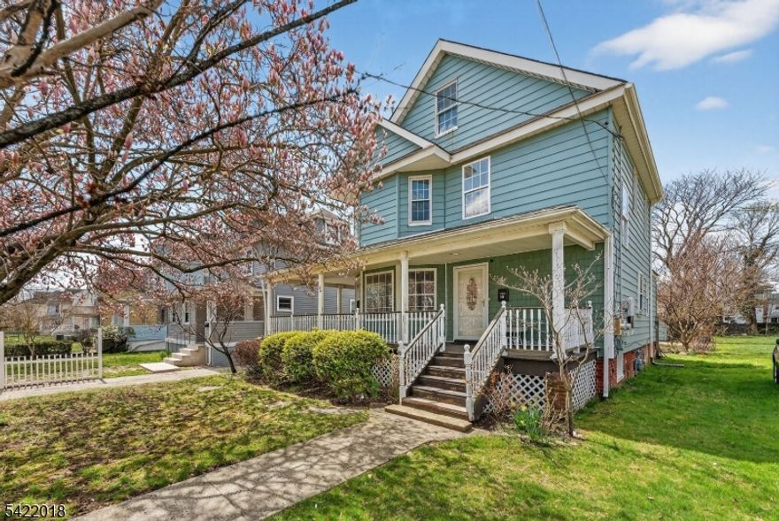 Location is everything: This picture perfect colonial with charming wrap around/rocking chair porch is ideally situated just .6 miles from the entrance to Seven Presidents Ocean Park and the vibrant Ocean Blvd. scene. Enjoy effortless access to the beach, popular Pier Village shops/restaurants, and local festivities from this prime Long Branch location. Home has been fully renovated over the past 8 years including full kitchen & bathroom remodels, updated hot water heater.  Chef's Kitchen is beautifully renovated with soft vanilla cabinetry, granite counters, breakfast bar & plenty of cabinets. Large living room with hardwood floors flows through original pocket doors to a grand dining room with access to the side porch for easy indoor/outdoor entertaining. 3 ample sized bedrooms PLUS a full finished attic for even more living space. 2 full bathrooms. Versatile 3 bedroom, 2 full bath layout plus a finished walk up attic offers extra room for an office or play area. Driveway & on street parking. Deep backyard complete w/ a large storage shed with electric, offering plenty of room for outdoor living and all your storage needs. This delightful turn-of-the-century Colonial has been masterfully reimagined to offer the perfect blend of historic character and 2026-ready convenience. Whether you're looking for a tranquil beach getaway, a savvy investment in an up-and-coming community, or a full-time residence, this home delivers.  Solar panels conveyed OWNED at closing.