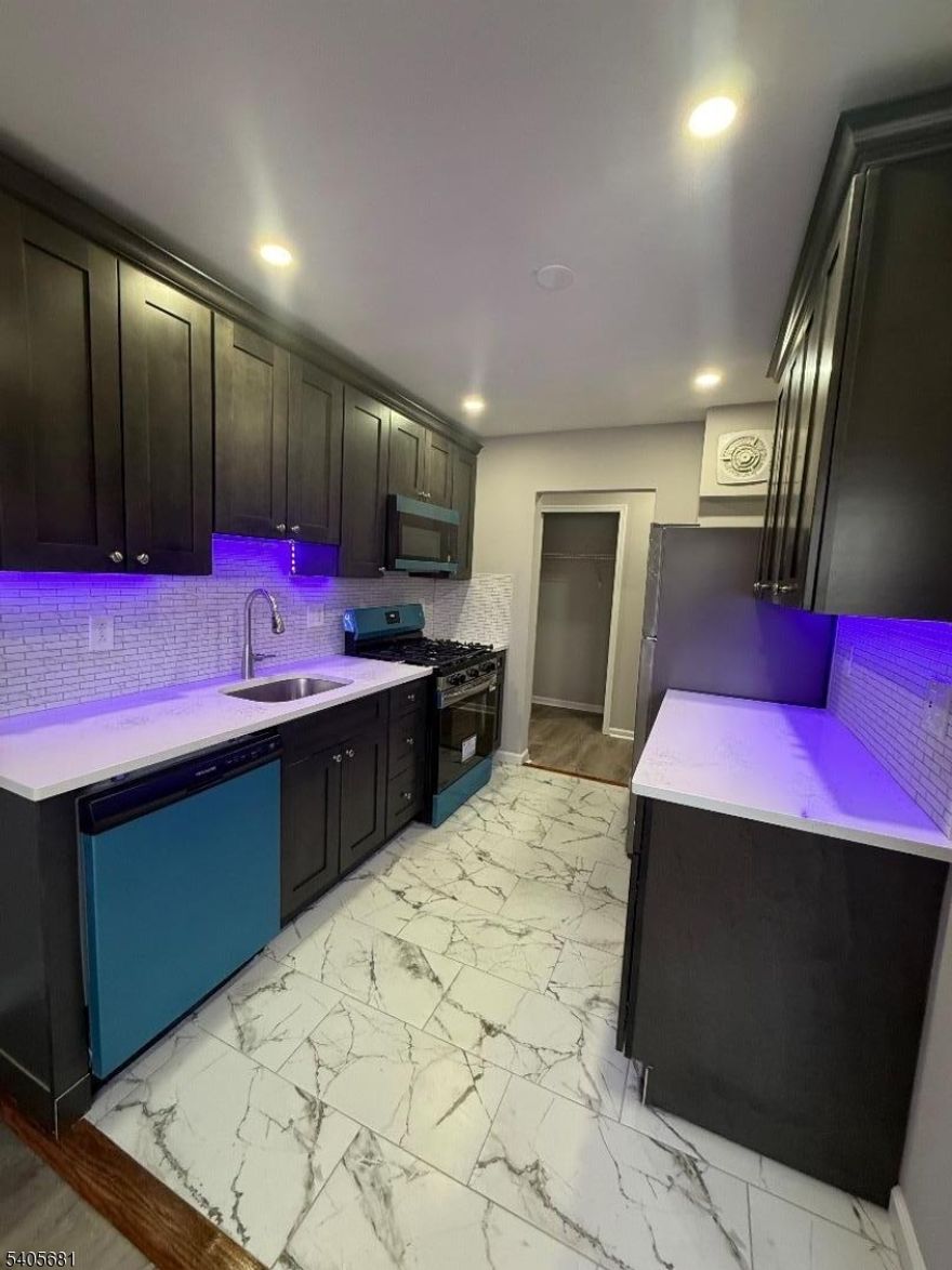 Beautifully renovated one bedroom apartment with new kitchen, granite counter tops, tiled back splash, stainless steel appliance included, microwave, dishwasher, refrigerator, ceramic tiled floors, reset lighting, wall air conditioning, freshly painted, beautiful hardwood floors throughout, ample cosets space, up dated tiled bathroom, laundry room, one assign parking space, heat hot water/cold water, cooking gas included in the rent.  Conveniently located near NYC Transportation, near shops and restaurants!!!!