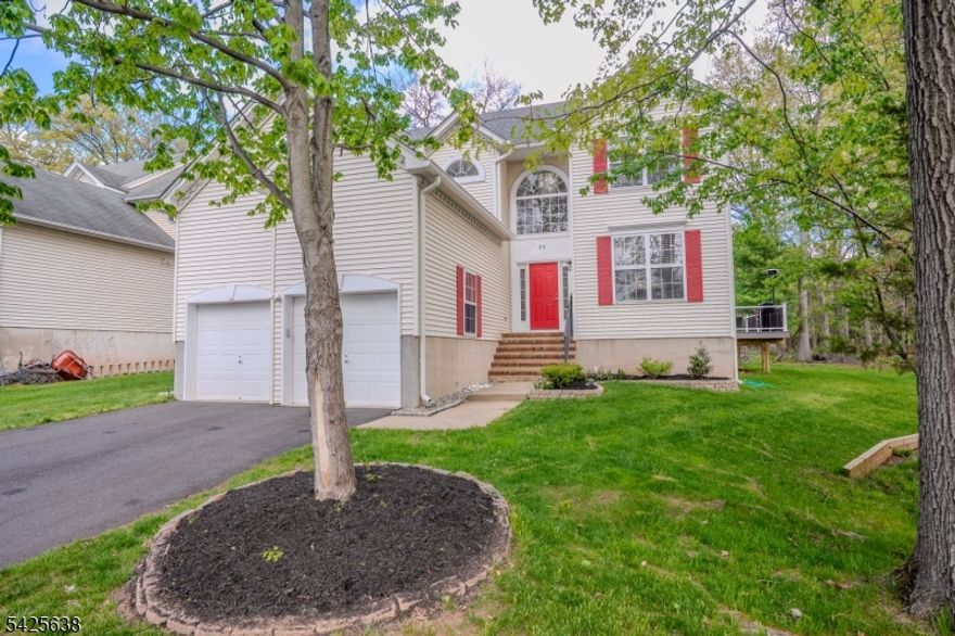 Welcome to this beautifully maintained and thoughtfully updated 4-bedroom, 2.5-bath home offering approximately 2,251 sq. ft. of comfortable living space in a desirable Bridgewater location. A grand two-story foyer with an elegant chandelier sets the tone for the warm and inviting interior. The first floor features hardwood flooring, recessed lighting, and custom blinds, creating a bright and modern feel. The updated kitchen (2018) offers quartz countertops, a designer backsplash, ceramic tile flooring, breakfast nook, pantry, built-in microwave, under-cabinet lighting, water filtration system, and a newer refrigerator (2021). The adjoining family room features a cozy gas fireplace. Upstairs includes newer carpeting and spacious bedrooms with ceiling fans. The guest bath is fully renovated with floor-to-ceiling porcelain tile, glass enclosure, and quartz countertop. The primary suite features two closets and a beautifully renovated bath with skylight, soaking tub, double sinks, quartz countertops, and a tiled shower with dual showerheads. Additional highlights include a first-floor laundry with built-ins, unfinished basement, and a 2-car garage with shelving and keypad access. Major updates include roof and HVAC (2021), furnace and hot water heater (5 years), and gutters (2 years). Enjoy outdoor living on the newer Trex deck with solar lighting, fire pit area, and Ring doorbell for added convenience.