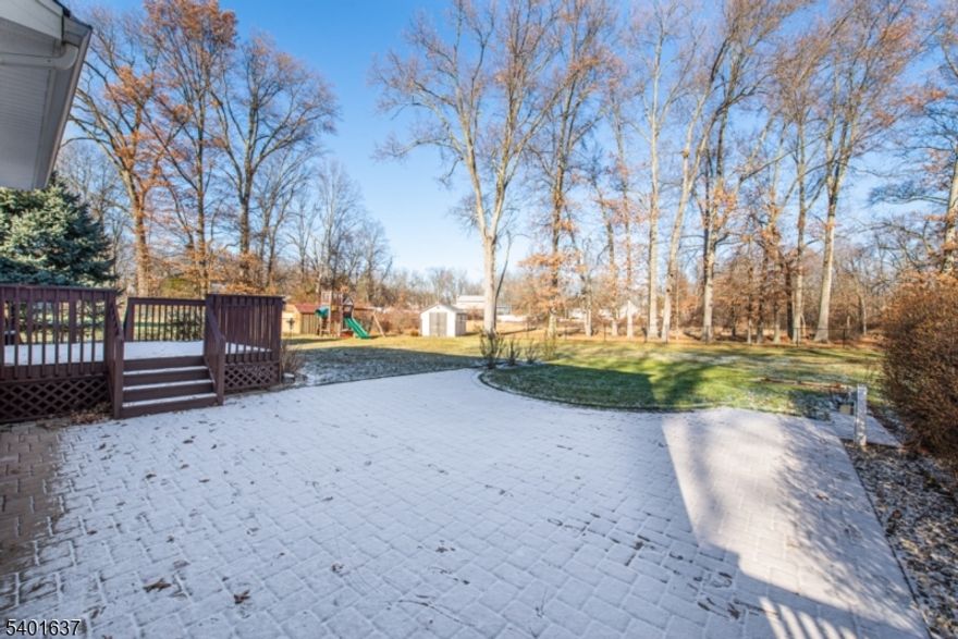 Completely renovated 4BR, 2.1BTH Colonial nestled in most of the most desirable neighborhoods in Parsippanny!  This home features a renovated EIK with granite counter tops, S/S appliances, tiled floor, crown moldings, recessed lights. Laundry/mudroom located off kitchen with built-in storage bench, cubbies, slop sink, W/D and garage door access. Sliders off kitchen lead to an expansive deck and pato. Dining Room has beautiful architectural molding detail, hardwood floors and French Doors opening to foyer. Living Room with beautiful crown moldings, hardwood floors and recessed lights. Primary BR features walk in custom closet and completely renovated primary bath with double sink wood vanity, granite counters, glass shower door. All bedrooms feature crown moldings, recessed lights and hardwood floors. Main bath has Quartz counters with white vanity, custom tiled wall, whirlpool tub/shower, heated floors, recessed lights. Full, unfinished basement with endless storage and possibilities for multiple uses.  This property sits on .60 acres with a completely private fenced in backyard plus storage shed. Conveniently located next to schools, shopping, major highways!