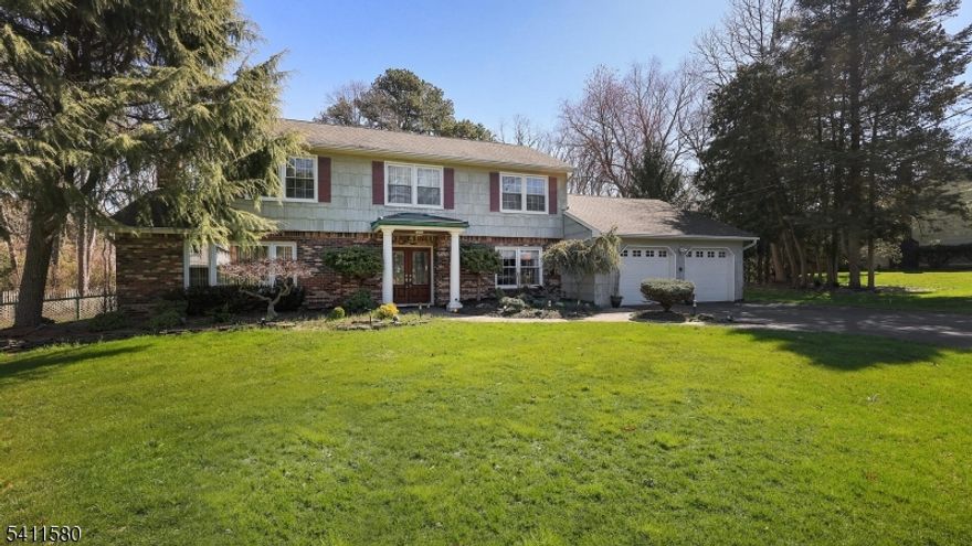 Welcome to this 5 bedroom/3.1 bath home offering space, style, and thoughtful updates throughout. The inviting exterior features classic brick and cedar shingle siding, a paver walkway, and a two-car garage set on a picturesque property. The updated kitchen is the heart of the home, showcasing cherry raised-panel cabinetry, granite countertops, a center island, tile backsplash, and stainless steel appliances including a gas cooktop, wall oven, microwave, refrigerator, and dishwasher. Oak flooring on the first level adds warmth and continuity, perfect for everyday living and entertaining. Cherry stained wood flooring throughout. The home offers a first floor spacious master bedroom with sitting room in a newer addition with a vaulted ceiling, creating a bright and airy retreat. The family room, also part of the newer addition, features vaulted ceilings and skylights, filling the space with natural light. A cozy den with a wood-burning fireplace provides the perfect setting for relaxing evenings. Spacious patio for outdoor entertaining. With its desirable layout, quality finishes, and attractive exterior, this home combines comfort and functionality in a sought-after Monroe location.