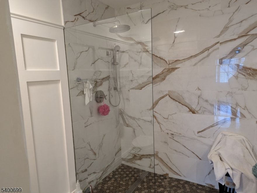 Townhouse end-unit with private location.  Custom updates included completely remodeled EIK and 2 1/2 baths.  Expanded loft space. This home boasts first and second floor master suites. Attic storage above garage with pull-down stairs.