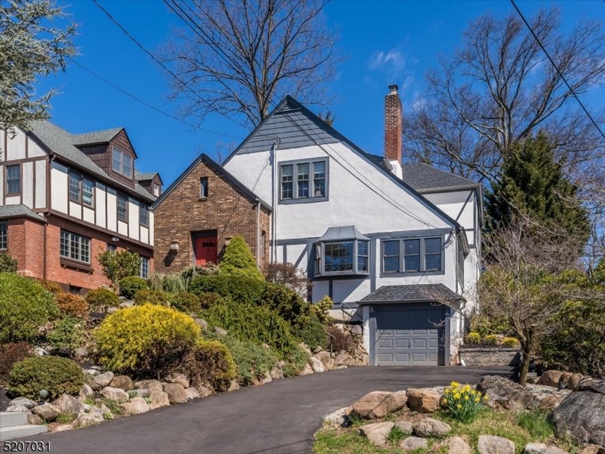 Everyday paradise! Newly expanded and renovated across three levels, this modern, open, and bright home offers an easy seamless lifestyle with nothing left to do but move right in! Step down from the large welcoming entrance foyer to the sun drenched living room featuring a wood burning fireplace and bay window and open to the cozy and inviting sunroom. A stunning, gracious, new kitchen and family room space is the heart of the home with an abundance of new windows and glass doors expanding across the rear of the home bringing in tons of light and gorgeous views of the deep, private, flat yard. The epicurean kitchen is thoughtfully designed with tons of custom cabinetry, high end appliances and an elegant quartzite topped center island. Bright, sun lit dining area with built in custom breakfast bar. Upstairs offers 4 generous airy bedrooms, 2 baths, and laundry. The primary bedroom boasts a tray ceiling, two closets, incl a WIC, stylish new relaxing en-suite bath, and tree top views. A spacious recreation room, exercise room, 5th bedroom, and full bath are found on the lower level.  Through sliding doors off the family room, access the oversized blue stone patio which expands across the rear of the house looking out over the deep private lawn. Perfectly suited for todays indoor-outdoor living, the patio and yard offer plenty of space for al fresco dining, lounging, playing and elaborate entertaining. A truly special home!