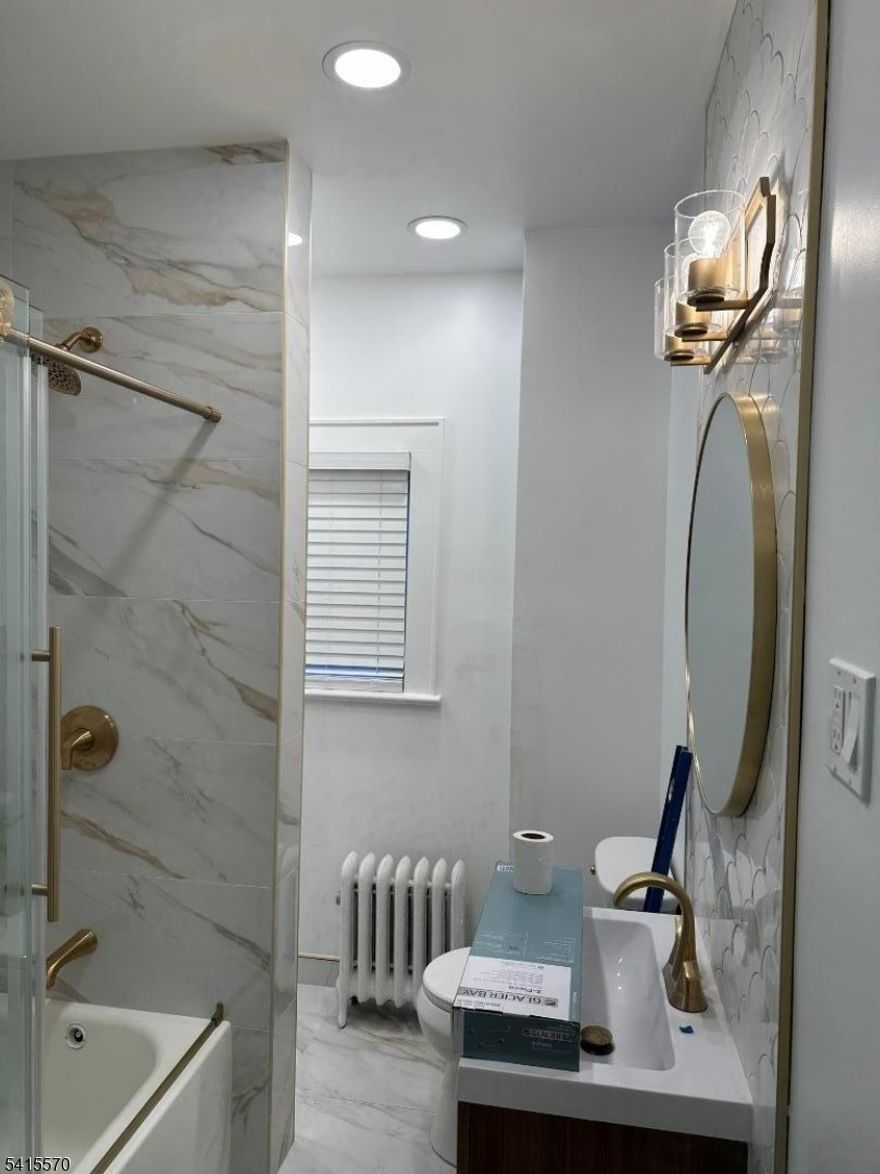 View City Lights in the Heart of Passaic Park across NYC bus stop. Multiple local stores just outside the apartment with access to restaurants, houses of worship and transportation. This is a renovated three (3) bedroom, new kitchen with new appliances and new washer dryer with new full bathroom. Back porch and large living and dining room. Come see this beautiful apartment and call it home today!