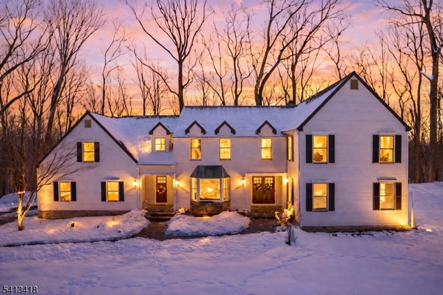 Welcome to this beautifully reimagined 4,437-square-foot Colonial, privately nestled on 4.73 picturesque acres at the end of a quiet cul-de-sac in highly sought-after Chester Township. With four bedrooms and four baths, this exceptional home offers a bright, open feel enhanced by fresh interior and exterior paint, refined modern finishes, and wide-plank LVP flooring that flows seamlessly throughout. At the heart of the home, the fully renovated chef's kitchen is both striking and functional, featuring sleek quartz countertops, premium Cafe appliances, and a layout designed for effortless entertaining and everyday living. Custom designer wallpaper elevates the dining room, while detailed millwork, elegant paneling, and stunning shadow box moldings add architectural character and timeless sophistication throughout. The primary and guest baths have been thoughtfully updated with a balance of comfort and elevated design. Newly installed interior doors, custom trim work, and recessed lighting throughout create a warm, cohesive ambiance. Brand-new garage doors complete the exterior with enhanced curb appeal. Blending classic Colonial charm with today's most desirable finishes, this turnkey estate offers the rare combination of privacy, acreage, and impeccable updates, an exceptional opportunity in one of Chester Township's most coveted settings.