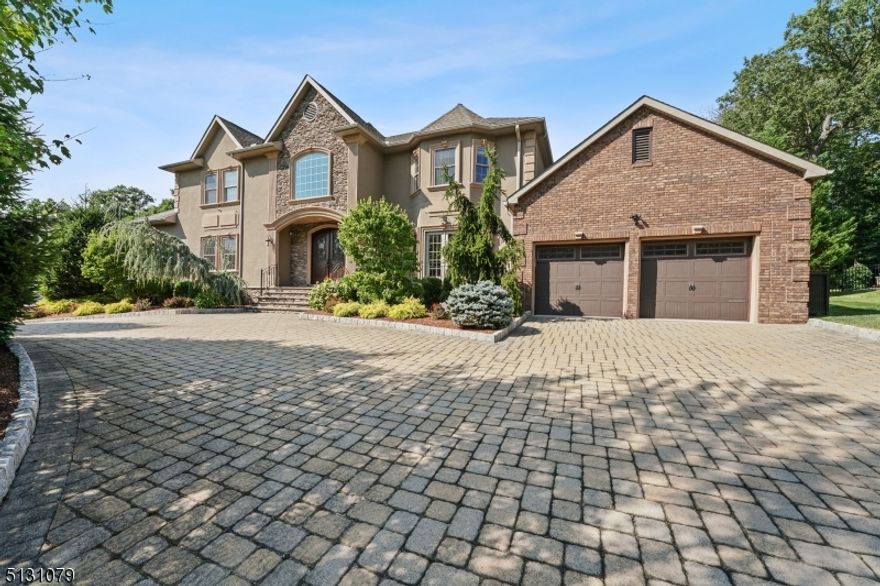 Expect to be impressed by this 6,000 sq ft (includes the basement) home built in 2010 with attention to detail.  From the instance you view the architecture, exceptional professional landscaping, and circular paver driveway you will you will know you have founcd your home. This home checks all your must haves beginning with the two story entry, 9ft ceilings and tigerwood floors, Chef's kitchen with Shaker style white 42" cabinets, quartz counters, stone floor, 6 burner Kitchen Aid cooktop with commercial hoood, center island, double wall oven w convection, 2 beverage refrigerators, stainless steel farmer's sink,new Samsung refridgerator, Kitchen Aid dw, and walk-in pantry. Kitchen is open to the family rm with suround sound, gas fpl,and built in wall unit. King size dining rm for entertaining,living rm, office, ensuite bedroom w private entry,mud rm and powder roomcomplete this level. Second level includes 4 bedrooms, Jack and Jill bath, princess suite and laundry rm plus storage area. The master bedroom features a tray ceiling, two walk-in organized closets, shower w to shower heads and soaking tub,Additional living space is afforded with the finished basement, built-in entertainment section, full bath and storage. Relax or entertain in the private backyard w huge paver patio and kichen facility. This home has smart thermostates, smart smoke detectors, 2 zone heating and C/A. Recessed lights, custom moldings, willbe found throughout the home.