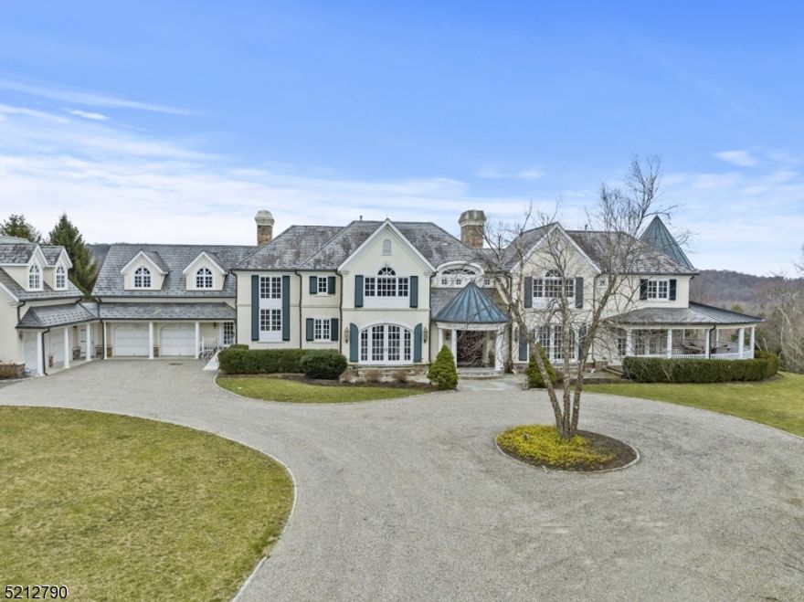 Welcome to your dream home! This custom-built masterpiece boasts over 7,000 square feet of luxurious living space, with 5 bedrooms, 5 full baths, and 2 half baths. As you step through the front door, you'll be greeted by an open layout that is both spacious and inviting. The first floor features a beautiful dining room, a stunning office with a wood-crowned ceiling, a great room that features soaring cathedral ceilings and a giant fireplace, an eat-in kitchen complete with a large island and lots of cabinetry and a glass filled sunroom. The second floor has five bedrooms and five full Baths which includes a beautiful Primary with a fireplace, his and her full bathrooms and 2 walk-in closets. All the rooms in this home are filled with natural light creating a bright and energetic atmosphere. Walk outside on the 3000 sq ft wrap around porch and stand atop the rolling hills, greeted by breathtaking views that stretch out before you. The lush, verdant trees that cover the landscape create a stunning backdrop as the birds soar through the air. These majestic views create a serene feeling like never before. Close proximity to NYC....Location, Location, Location!!!