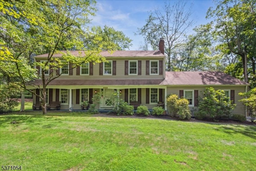 Welcome to this timeless Colonial nestled on a scenic corner lot in Randolph's desirable Ironia section. Full of warmth and character, this spacious home offers an ideal layout for everyday living and entertaining. Set in a neighborhood known for top-rated schools, parks, trails, local shopping, and easy commutes the home enjoys both comfort and location. Step inside to a bright foyer that opens to the formal living room on one side and a spacious family room on the other, featuring a classic brick wood-burning fireplace and custom built-ins. The formal dining room connects seamlessly to the screened porch, while the heart of the home the sun-filled eat-in kitchen offers ample space. A powder room and laundry/mudroom with its own private side entrance complete the main level. The screened porch provides the perfect spot to enjoy your morning coffee or unwind in the evening, all while overlooking the serene, tree-lined backyard. Upstairs, you'll find four generously sized bedrooms, including a spacious primary suite with a dressing area, WIC, and private bath. Wood floors run throughout the home, adding warmth and charm to every space. The full basement is partially finished with a rec area, workshop, and direct access to the 2-car garage perfect for hobbies. With two garage entrances one from the mudroom and one from the basement convenience is built right in. This is your opportunity to create your dream home in one of Randolph's most beloved neighborhoods.