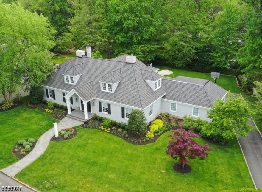 This magnificent, modern Colonial is ideally situated (0.62ac) on one of the most coveted streets in Short Hills. Completely gut-renovated-to-perfection, this sophisticated dream home has-it-all w/ everything new & unparalleled attention to every detail. Thoughtful open floor plan & crisp architectural elements include: 2-story, foyer w/ signature staircase, high ceilings, gleaming wd flrs, top-tier technology, built-in speakers, banquet-sized dining rm, fab gas FPs, 2PRs & 1st flr office. Gourmet kitchen has custom cabinetry, quartz counters w/ seating, breakfast rm, SS appliances (Meile, Wolf, SubZero), bar area & wine refrigerator. It also is open to fireside family rm creating an ideal space. The luxurious, 1st flr, primary suite is your own private retreat w/ vaulted ceiling, smart ceiling fan, his/her custom-fitted closets & spa-like bath. The primary with a double vanity, custom tile, heated floor, tub and oversized glass shower. Upstairs: 4 more BRs & 2 renovated baths. LL is ready to impress! 6th BR & full bath, laundry rm, gym & incredible rec rm w/ projection screen & surround sound. Mudroom w/ coat closet, pantry & att 2-car garage w/ level-2 electric car charger. Back of the house has French doors to expansive patio--amazing space overlooks lush/level property w/ intentional landscaping. Near all top-rated Millburn Schools (Deerfield Element) & Millburn Train Station for easy access to New York City. The perfect harmony of refined luxury & everyday comfort.