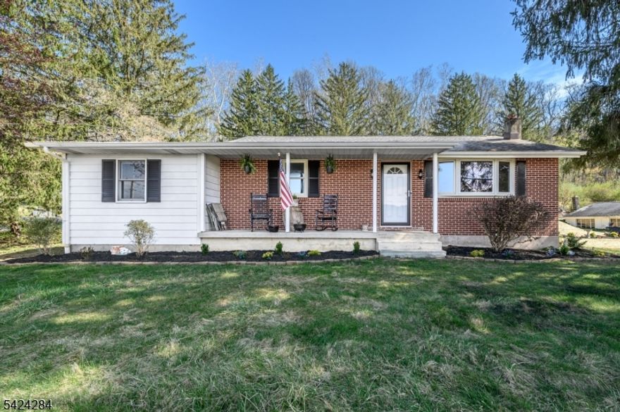 Welcome home! Lovely 2 Bed 1 Bath Ranch with an Oversized Detached 2 Car Garage on a sprawling, private wooded lot in serene Holland Twp could be the hidden gem you've been searching for! Beautifully maintained, boasting a BRAND NEW septic tank, with plenty of space to expand, settle and grow, its the perfect opportunity for first time buyers, downsizers, or a great rental unit to add to your portfolio. Step in to find a spacious, light and bright open living/dining combo with hardwood floors that shine, recessed lighting, tons of natural light, and a crisp modern palette that is easy to customize. Eat-in-Kitchen offers sleek SS appliances, gorgeous granite counters, newer laminate flooring, ample cabinet storage, and access to the rear deck for easy al fresco dining. Down the hall, find the main full bath with tub shower, along with 2 generous bedrooms. The primary bedroom boasts its own bonus room, which can double as a home office, extra bedroom, den, etc. Full basement with laundry, workshop area, utilities, plenty of storage space, and a freestanding wood burning stove adds to the package. Peaceful outdoor area holds a covered patio, deck, storage shed, and plenty of extra space to relax and enjoy the great outdoors, backing to private wooded views. Oversized detached 2 car garage with long, double wide driveway offers ample guest parking. All of this and more, ready and waiting for you. Don't miss out! Come and see TODAY!