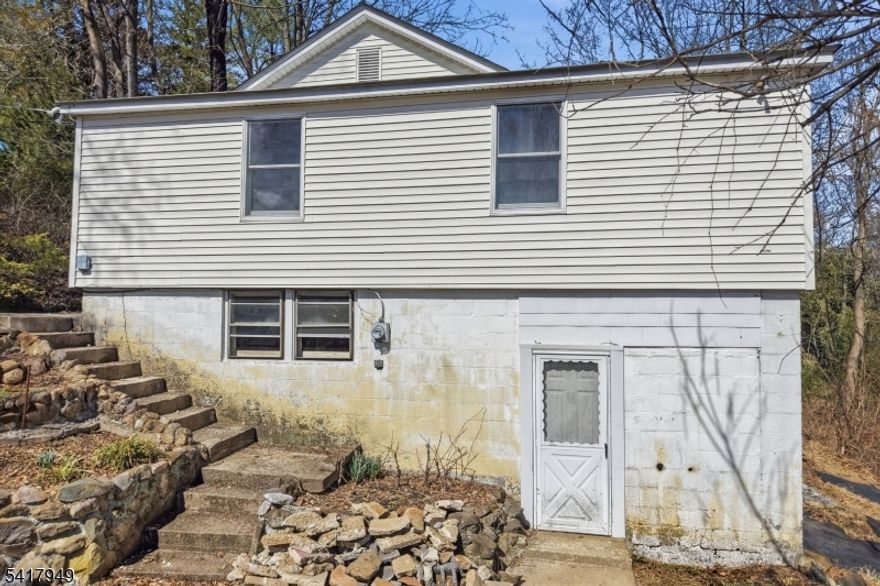 Handyman Special with Serious Upside! Instant Equity To Be Earned  ARV $545,000+! Welcome to 10 Minnehaha Path in desirable Lincoln Park, offering a rare opportunity for investors, renovators, or buyers looking to create their dream home. This 3-bedroom, 2 full bathroom property is in need of major TLC but boasts incredible potential throughout. The main level features a spacious living room, formal dining room, nicely sized kitchen, and three bedrooms, including a primary suite with its own full ensuite bathroom. The lower level offers a large unfinished basement, providing endless possibilities for additional living space, storage, or customization. Perfectly positioned at the end of a quiet street, this home offers a unique, mountain-like setting that feels private and serene truly unlike anything else in the area. Conveniently located near NYC train and bus transportation, major highways, and a vibrant town center filled with restaurants and amenities. Being sold strictly as-is. Incredible value, endless potential don't miss your chance. Schedule your private showing today!