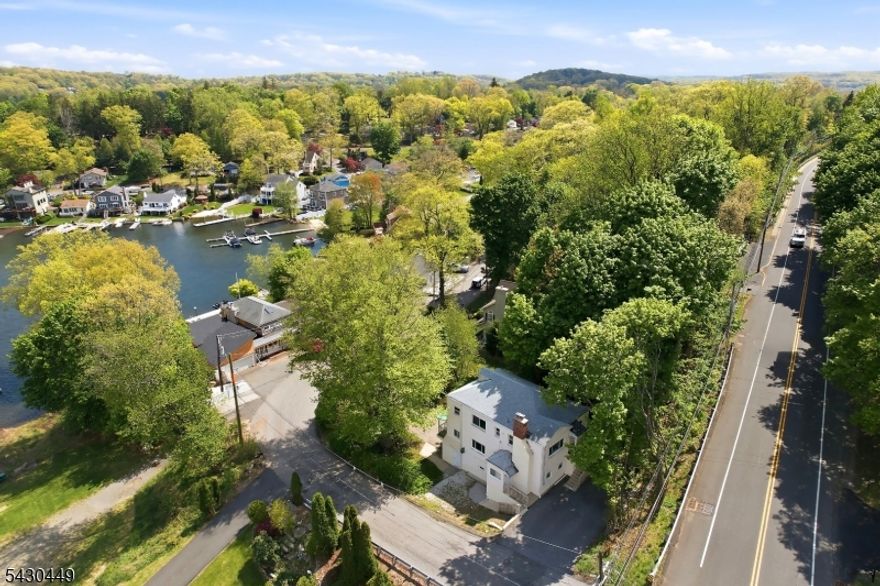 Rare lakeside opportunity! This beautiful 3-family home features stunning lake views and sits right in a premier lake community. Ideal for investors or first-time buyers. Delivered fully vacant and ready to go. Must see!