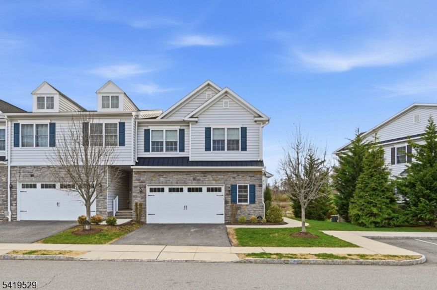 Luxury Alert! Welcome to refined living in this exceptional 3  bedroom large Clemson Townhome, perfectly positioned on a premium lot with sweeping views of the pond and golf course. From the moment you enter, the upgraded home showcases a seamless blend of elegance and modern comfort. The stunning open floor plan, designed for both everyday living and upscale entertaining offers a gourmet kitchen which anchors the space, featuring upgraded cabinetry, sleek finishes, and an oversized center island. Cozy up to the fireplace or use the sliding glass doors that lead to a deck with natural gas grill and pond view. Upstairs, a spacious landing loft adds flexibility ideal for a den, home office, or lounge. The extra large primary suite is highlighted by a tray ceiling that adds architectural charm and walk-in closet and an  en-suite  offers a spa-like experience with a large walk-in shower and a luxurious jacuzzi tub. The 2nd floor is finished with 2 additional bedrooms, full bath, and large laundry room. The fully finished basement with full bath, expands your living space even further, boasting high ceilings and abundant natural light, recreation area; fitted with exercise equipment, media room, and pool table. Every upgraded detail reflects care and quality, delivering a sense of pristine, luxury living. Upgrades also include EV charging, custom landscaping, and a large custom garage.  Ideally located next to the Red Bulls facility and  just minutes  downtown Morristown!