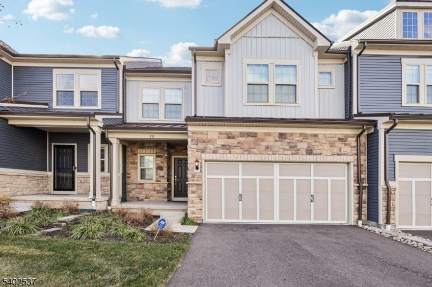 All the features of a single-family home complete this townhouse! Walk into your foyer with a view of arched ceilings, pass the office, into a great room with a fully updated chef's kitchen, featuring center island, upgraded appliances, floor to ceiling cabinetry and a layout suited for entertaining. Dining area off the kitchen has plenty of room for an 8-seater table and the living area has room for a large sectional sofa. Walk past the living room to a private back deck that overlooks a grass area and privacy trees just behind. Generously sized master bedroom features two large closets, a luxury couple's bathroom and extra tall rear facing windows that allow both plenty of sunlight but also privacy. First floor also has a separate entrance through the 2-car garage with mud area and laundry with sink. Walk upstairs to a spacious landing, two very large bedrooms and a den that can suit any need (second office, guest room, playroom, bedroom, whatever!).The unfinished basement is the full footprint of the home and with high ceilings. All bathrooms feature luxury fixtures and finishings. Seller spared no expense on builder upgrades. You will want to make this home!