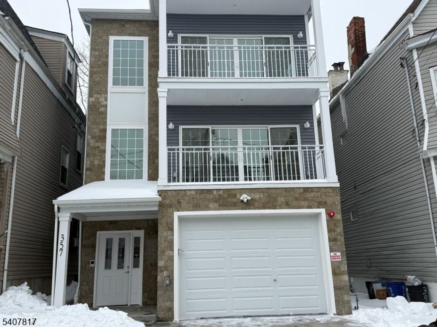 Built in 2025 and never lived in, this stunning property offers the perfect opportunity to own brand-new construction with modern finishes throughout.Units One and Two each feature three spacious bedrooms, including a luxurious primary suite with a private bathroom. Enjoy a beautifully marble-tiled walk-in shower and a separate area leading into the bath perfect for creating an organized dressing space. Both units also include a private balcony.The third unit offers two bedrooms and one full bath, thoughtfully designed with comfort and functionality in mind.All units boast gorgeous kitchens equipped with ample cabinetry, a lazy Susan, stove, microwave, elegant backsplash, marble-tiled flooring, and hardwood floors. You'll appreciate the abundance of storage and closet space, large windows that fill the home with natural light, and convenient in-unit laundry hookups. Each unit also includes an intercom system for added security and convenience.Additional features include an enclosed backyard, private driveway, and an oversized garage with remote access.Ideally located just minutes from Downtown Newark and Newark Penn Station, with easy access to Routes 78 and 280 (East & West). Conveniently situated near University Hospital, ShopRite, popular restaurants, and public transportation including bus, train, and subway lines.Don't miss the chance to make this beautiful, brand-new home yours!